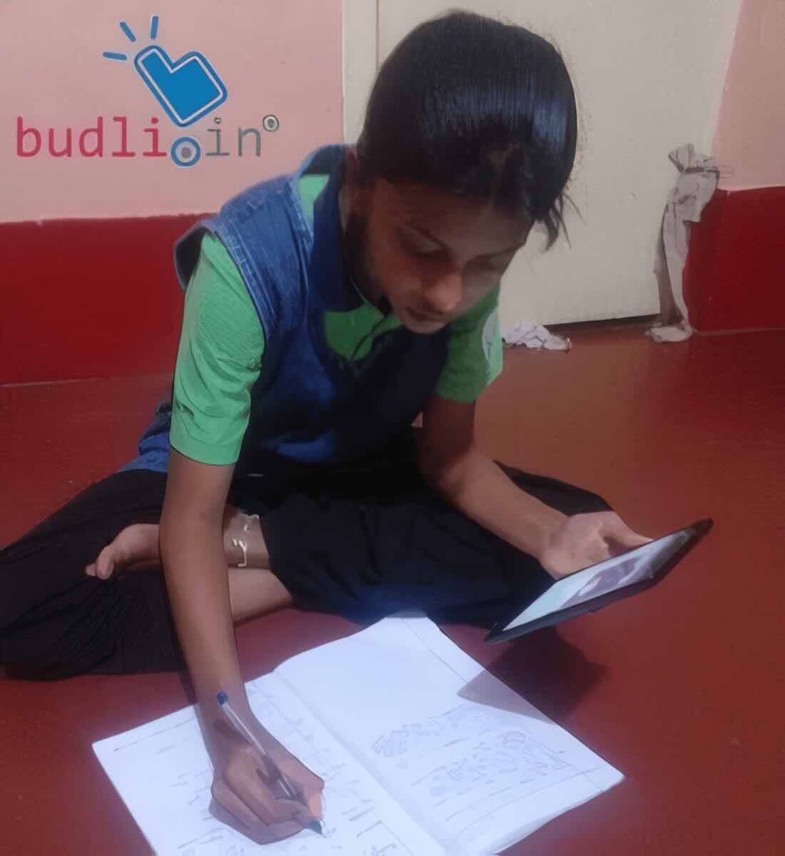 A student receiving a donated laptop through Refurbify Device to Dream